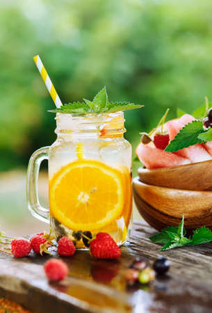 A refreshing drink on a hot summer day in the garden. Shallow depth of fieldの写真素材