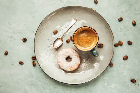 Cups of Coffee with foam and homemade doughnut.の写真素材