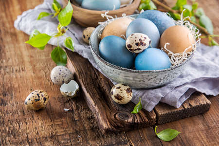 Colorful Easter eggs on wooden surfaceの写真素材