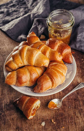 Tasty croissants on old wooden table. Selective focus, rusticの写真素材