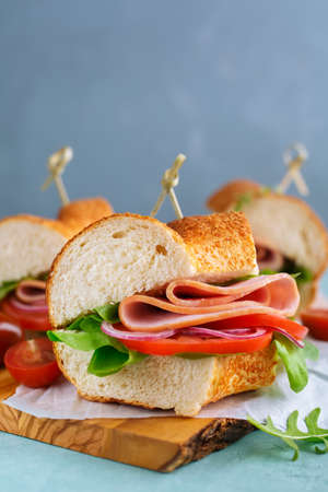 Sandwiches with ham and vegetables. Food background with copyspace