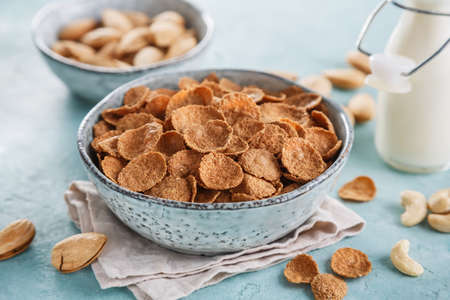 Wheat bran breakfast cereal with milk and nuts. Healthy diet breakfastの写真素材