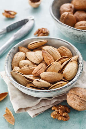Almonds and cashews in a bowl closeup. Healthy foodの写真素材