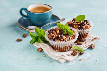 Chocolate Muffins garnished with Mint leaves and Coffeeの写真素材