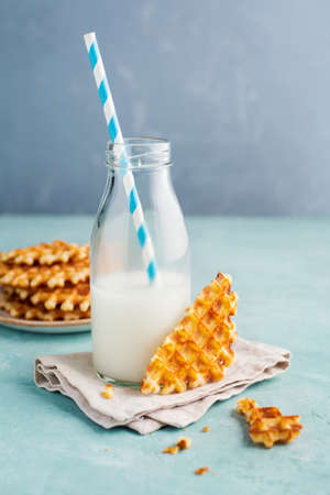 Tasty crispy waffles with milk. Food background, Selective focus.の写真素材