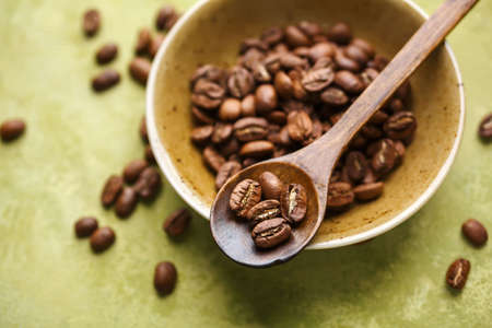 Fresh coffee beans in a bowl. Selective focusの写真素材