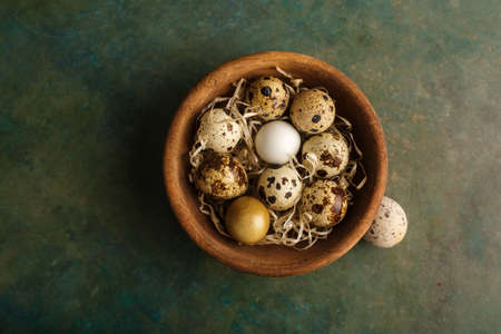 Quail eggs in a wooden bowl. Farm products, bio product, food conceptの写真素材