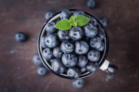 Fresh blueberries in a cup. Healthy food. Top view.の写真素材