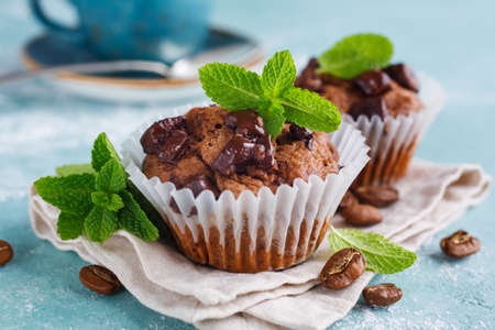 Chocolate Muffins with Mint leaves, close-up. Selective focusの写真素材