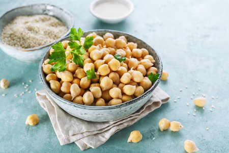 Ingredients for cooking hummus. Chickpeas, sesame seeds and oilの写真素材