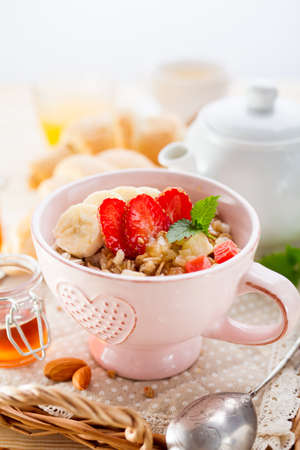 Oatmeal with banana and strawberries. Delicious Breakfast.の写真素材