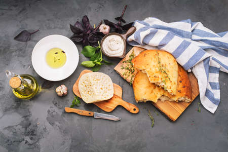 Traditional Italian Focaccia with herbs and cheese. Top viewの写真素材