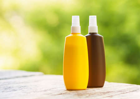 Sunscreen on a wooden table.の写真素材