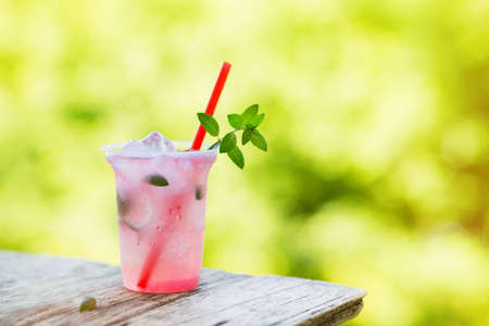 Lemonade with ice and mint in the fresh air.の写真素材