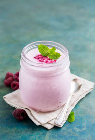 Natural homemade yogurt with raspberry and mint, selective focus, copy spaceの写真素材