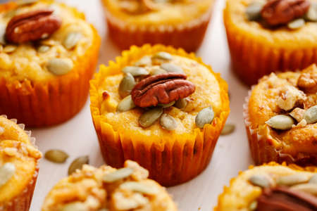 Homemade muffins of pumpkin with pecans. Close upの写真素材