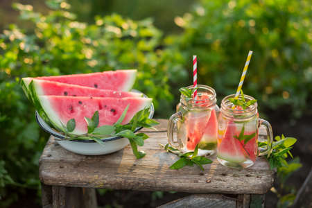 Detox Cocktail of Watermelon in glass jars in the open airの写真素材