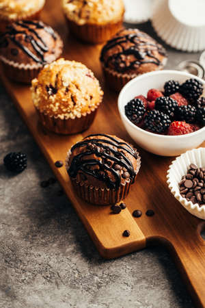 Muffins with chocolate and berriesの写真素材