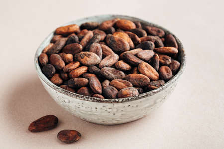 Cocoa beans in a bowlの写真素材