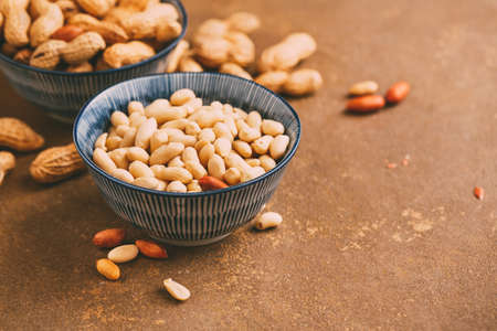 Peanuts in bowls wiht copy space. Toned imageの写真素材