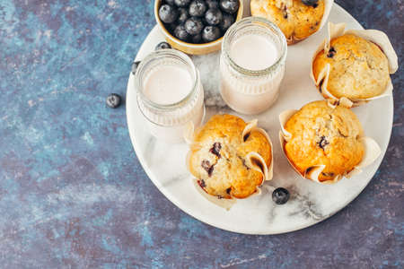 Homemade muffins with blueberries and yogurtの写真素材