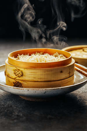 White rice in bamboo steamerの写真素材