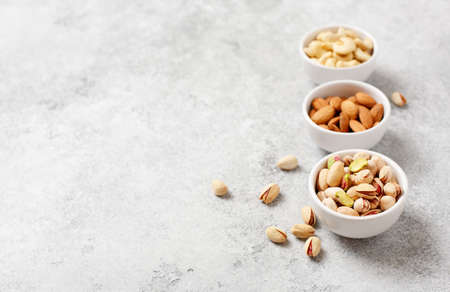 Fresh organic nuts, almonds, cashew, pistachio. Healthy food and cuisine copy spaceの写真素材