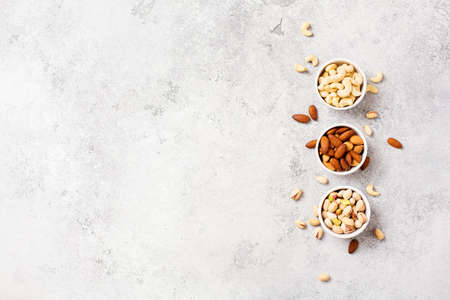 Fresh organic nuts, almonds, cashew, pistachio. Healthy food and cuisine copy space, top viewの写真素材