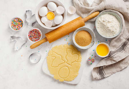 Raw Easter cookies on a marble board, closeup. Baking and cooking concept, top view.の写真素材