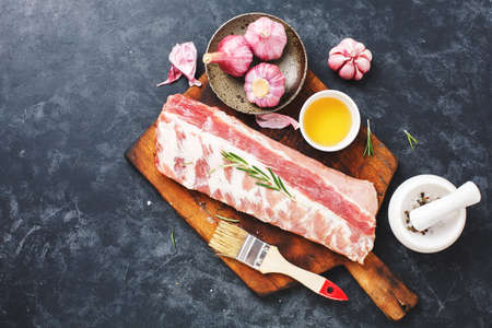 Raw pork ribs with rosemary and garlicの写真素材