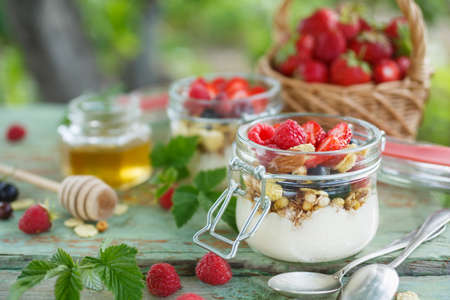 Healthy yogurt with granola and raspberry.の写真素材