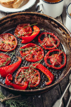 Oven-baked tomatoes with thyme. Shallow depth of fieldの写真素材