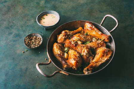 Baked chicken drumstickの写真素材