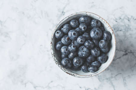 Fresh blueberries in a bowlの写真素材