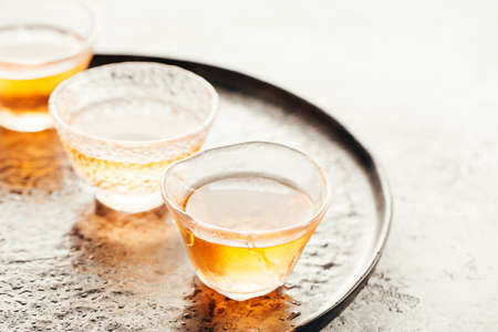 Chinese tea in glass cups on a trayの写真素材
