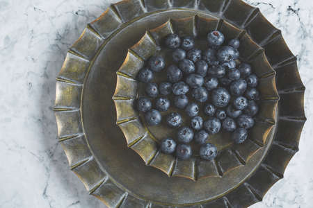 Fresh blueberries in a bowlの写真素材