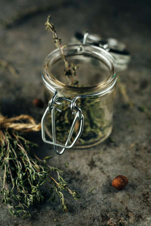 Spice jars with thyme.の写真素材