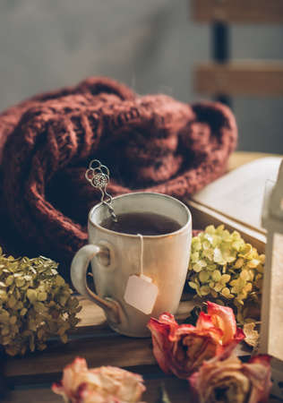 Hot tea in a mug. Autumn still life