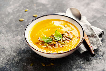 Spiced Pumpkin, Carrot, and Sweet Potato Soup. Selective focus.の写真素材