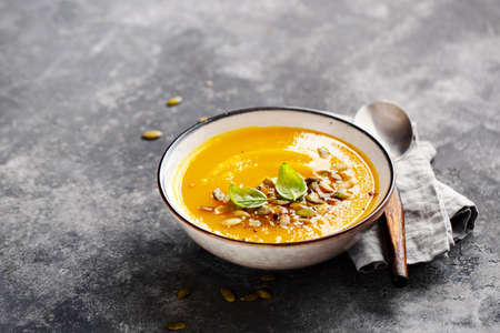 Spiced Pumpkin, Carrot, and Sweet Potato Soup. Food background with copy space.の写真素材