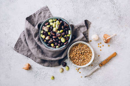 Organic lentils and raw broad beans. Ingredients for cooking. Top view.の写真素材
