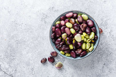 Raw organic broad beans in bowl. Healthy food. Top view.の写真素材