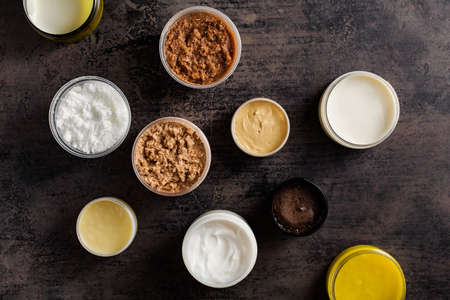 Different scrubs and body creams and cosmetics masks. SPA and Body care products, Top view.の写真素材