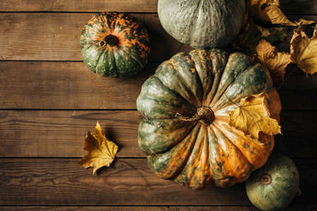 Pumpkins on a wooden tableの写真素材