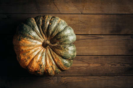 Pumpkin on a wooden tableの写真素材