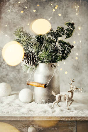 Vintage Christmas festive decoration, Snow-covered Christmas tree Branches,balls and reindeer.の写真素材