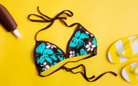 Bikini on a yellow background.の写真素材