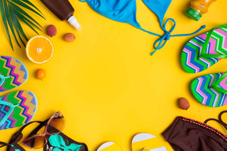 Beach accessories on yellow backgroundの写真素材