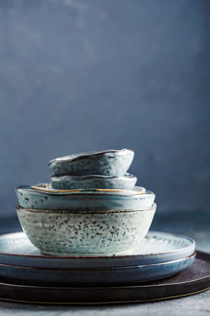 Tableware set on a blue background.の写真素材