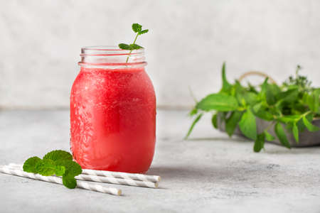 Watermelon smoothies in glass jars.の写真素材